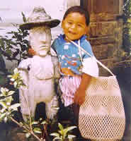 Mayan child and Mayan statue